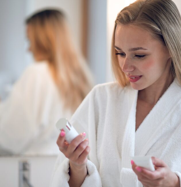 Skincare products featuring active skincare products, retinal night cream, and morning vitamin C serum arranged as part of a simple routine.
