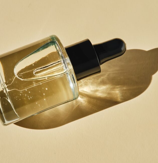 Woman comparing Australian skincare products, active skincare and best retinal products as she considers peptides for skincare.