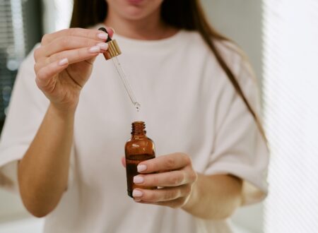 Woman comparing Australian skincare products, active skincare and the best skincare products in Australia to build a simple skincare routine.