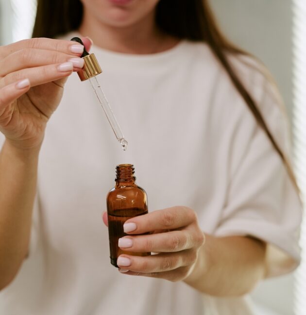 Woman comparing Australian skincare products, active skincare and the best skincare products in Australia to build a simple skincare routine.