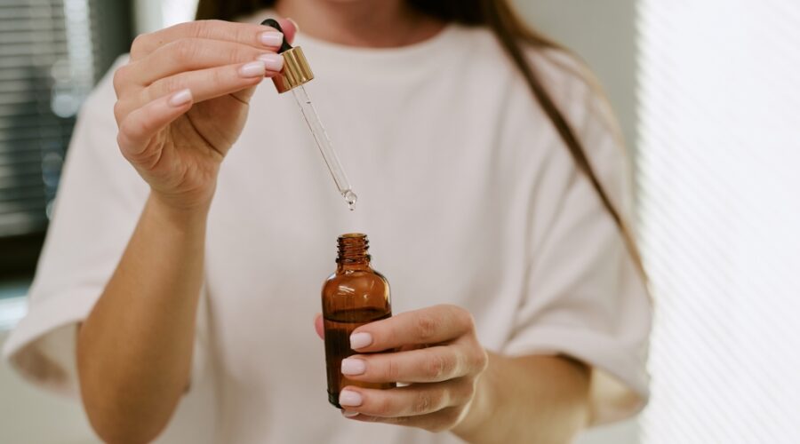Woman comparing Australian skincare products, active skincare and the best skincare products in Australia to build a simple skincare routine.